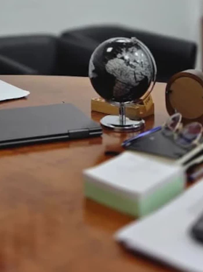 A desk globe on the partner's table