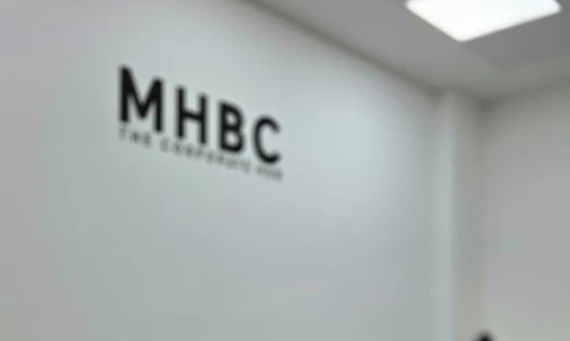 The MHBC wall sign in the office.